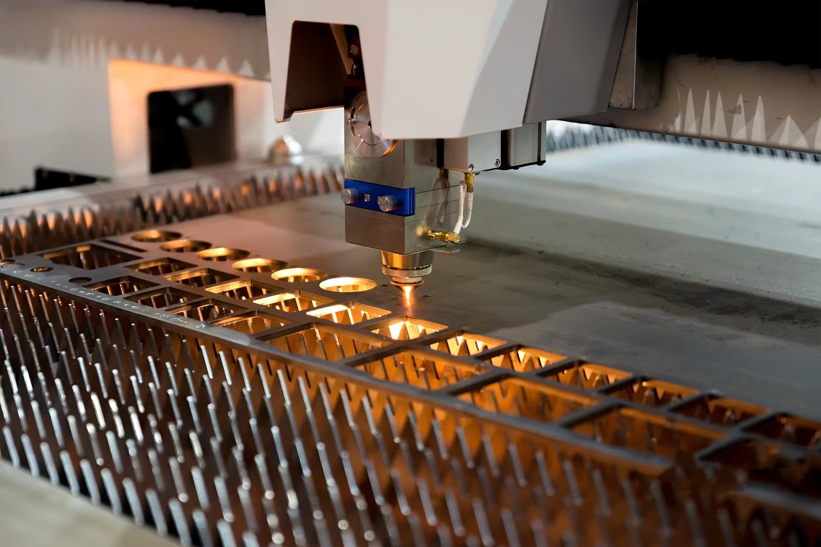 What are the uses of laser cutting in the automotive field?